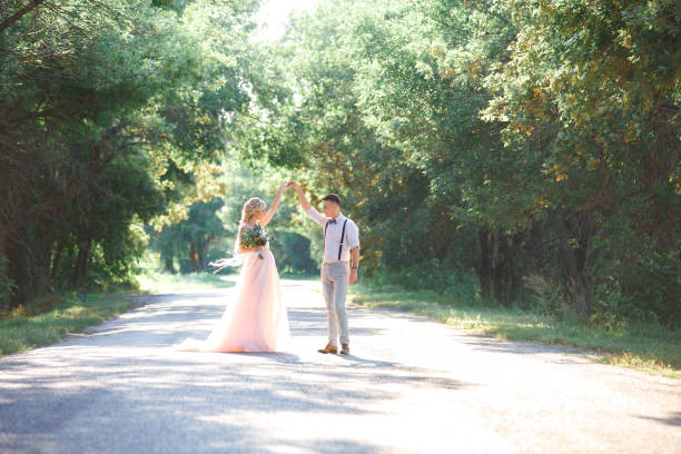 istock wedding couple on the nature in summer day. 1057186512