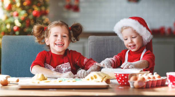 istock happy children bake christmas cookies 1057186790