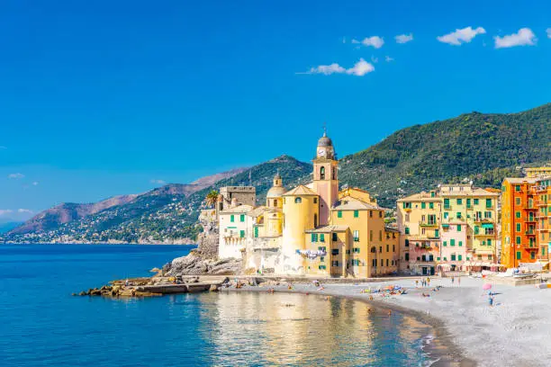 Scenic Mediterranean riviera coast. Panoramic view of Camogli town in Liguria, Italy. Basilica of Santa Maria Assunta and colorful palaces. Italy