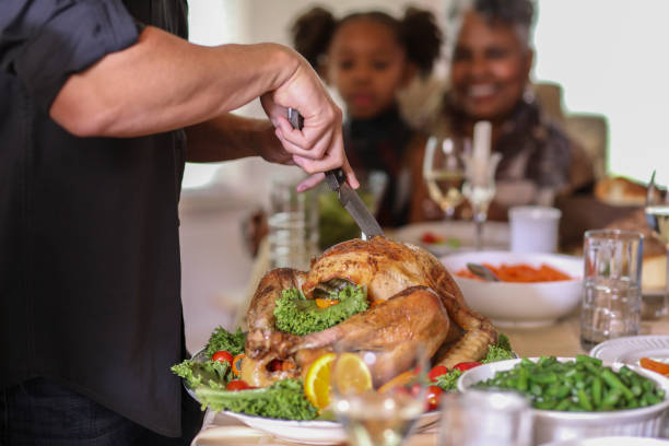 istock Roasted turkey on platter during Thanksgiving dinner. 1057189242