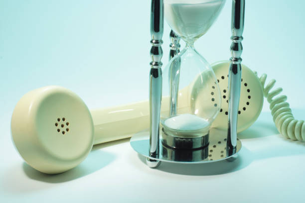 istock Hourglass and Telephone Receiver 1057190026