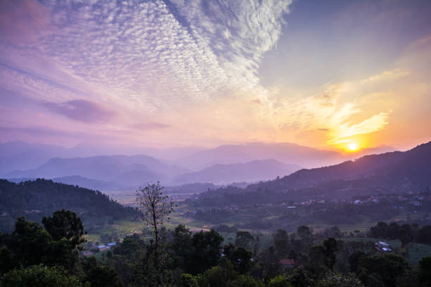 istock Village farm field and hill sunset 1057190248