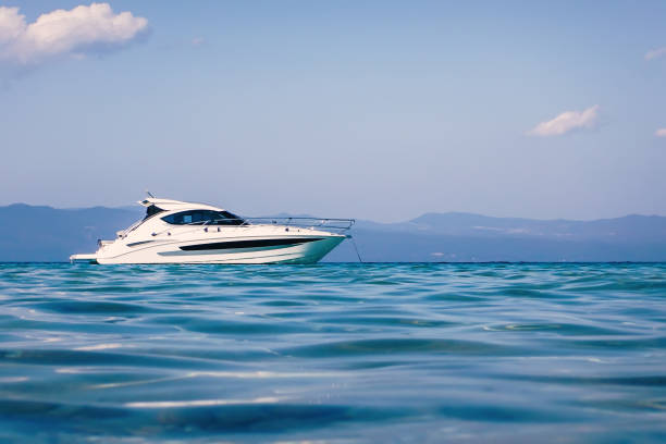 Motor boat floating on clear turquoise water