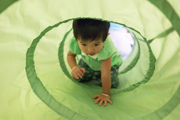 istock Cute baby Playing tunnel 1057202382