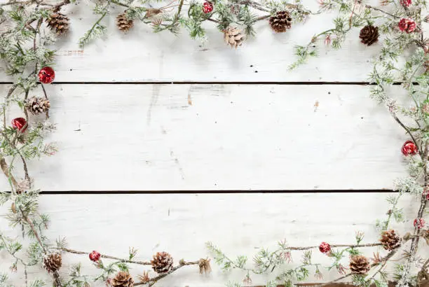 Photo of Christmas holiday pine wreath garland wood background