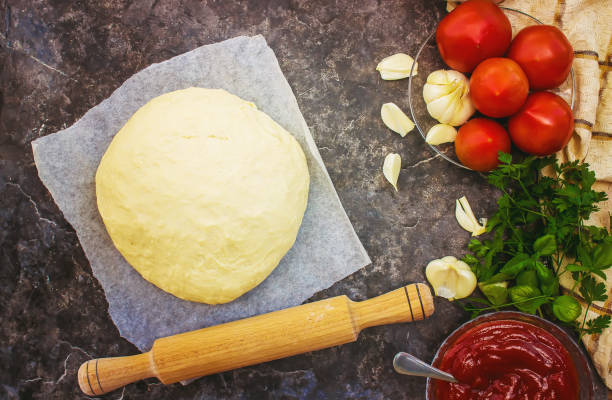 istock pizza cooking. selective focus. food and drinks. 1057205472