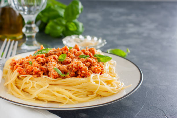 istock Spaghetti with meat ragout, tomato sauce and cheese, selective focus 1057209656