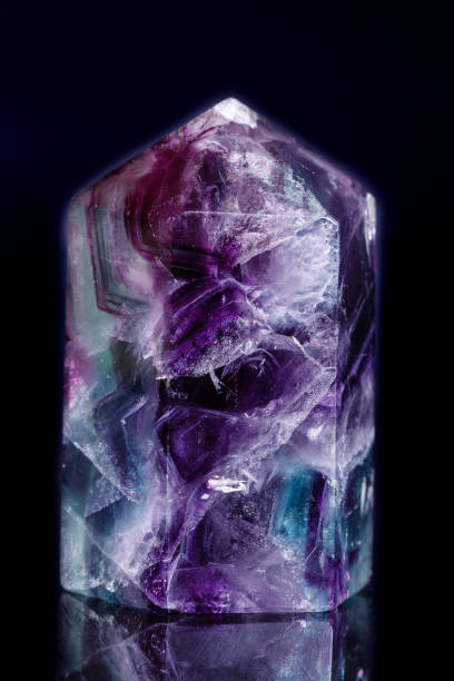 istock Macro mineral stone Fluorite crystal on a black background 1057209738