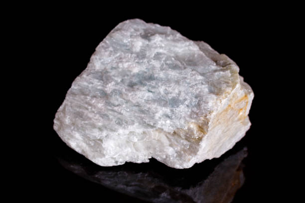 istock Macro mineral stone Talc on black background 1057209852