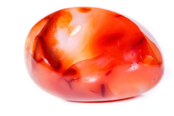 Macro mineral stone Carnelian on white background close up
