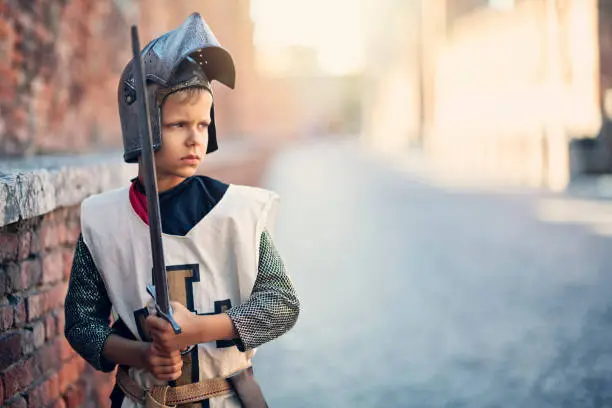 Serious little knight preparing for fight. The knight is going to defend his castle.
Nikon D810