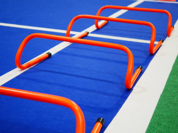 istock Three rows of Hurdles set up on track 1057217542