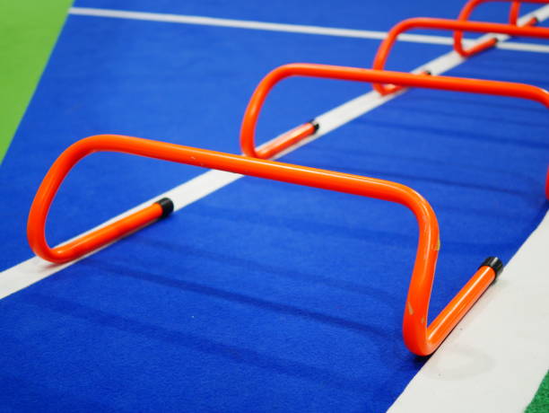 istock Three rows of Hurdles set up on track 1057217566