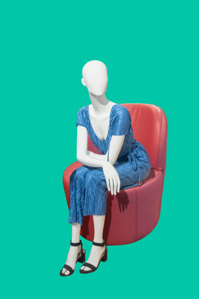 istock Female mannequin sitting on a chair. 1057218668