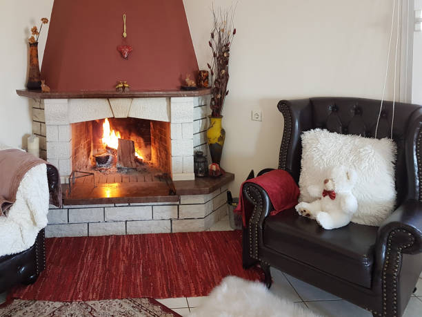 istock fire fireplace winter home interior stones white red 1057229116
