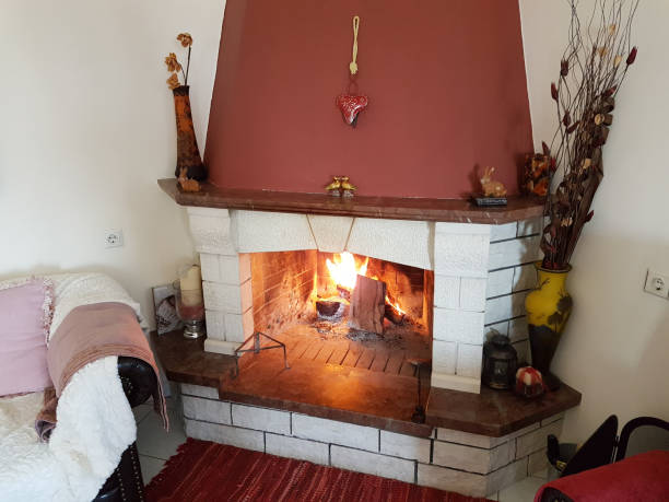 istock fire fireplace winter home interior stones white red 1057229174