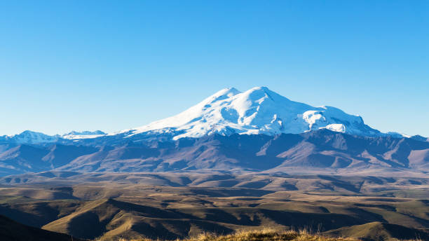 istock Mount Elbrus from Bermamyt at autumn morning 1057230452
