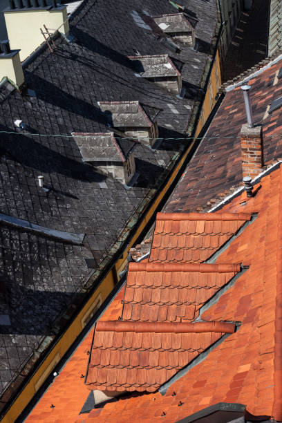 istock Red And Black Tile House Roof 1057232838