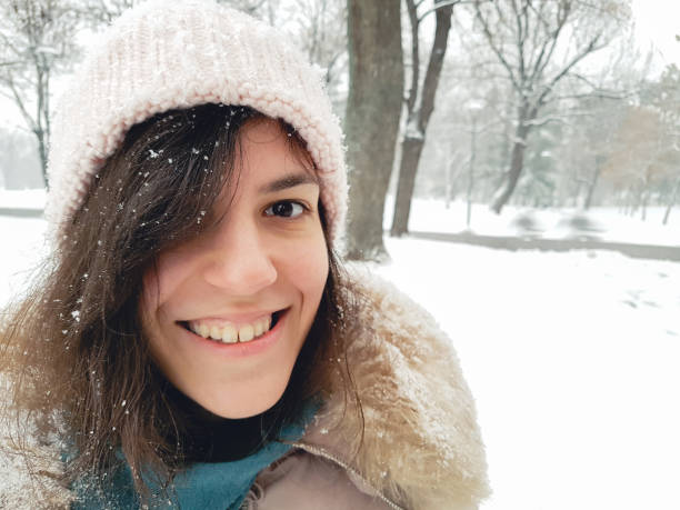 istock Woman making selfie in the snow 1057235348