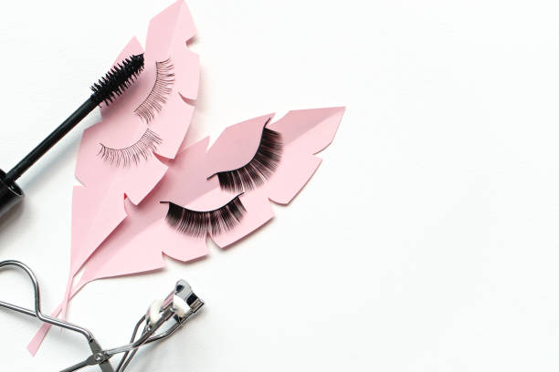 istock Black false lashes strips, mascara, curler  on white background 1057235392