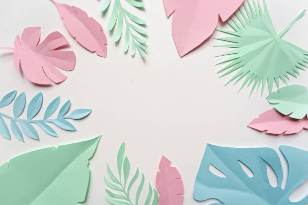 istock image of paper tropical leaves 1057236680