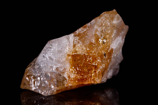 istock Macro mineral stone Citrine on black background 1057265238