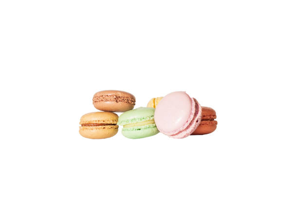istock Stack of various colors macaroni cookies isolated on white background 1057280490