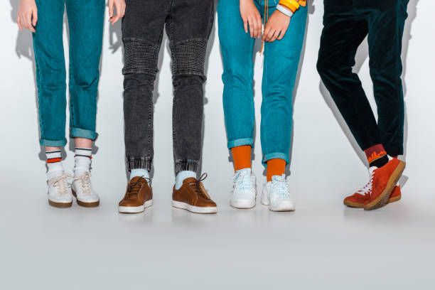 istock low section view of stylish hipsters legs on grey 1057282878