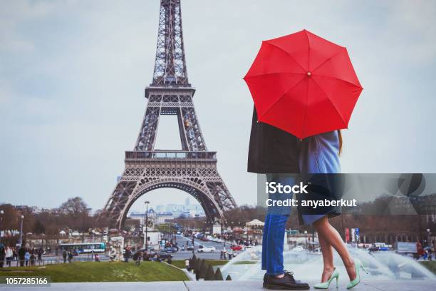 Rmantic Couple In Paris Kissing Near Eiffel Towe Stock Photo - Download Image Now - Romance, Paris - France, Couple - Relationship