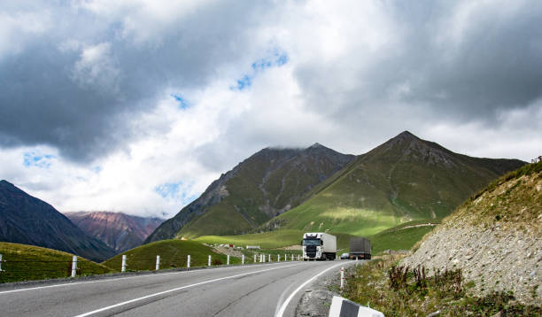 istock Mountain road spring ranges landscape. Mountain hill road panorama 1057287578