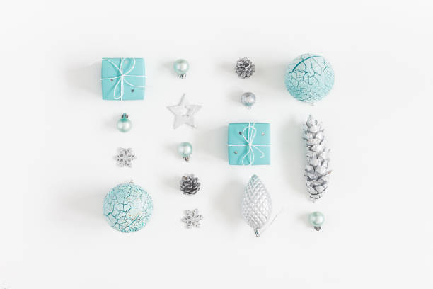 istock Christmas composition. Christmas gifts, blue and silver decorations on white background. Flat lay, top view 1057289444