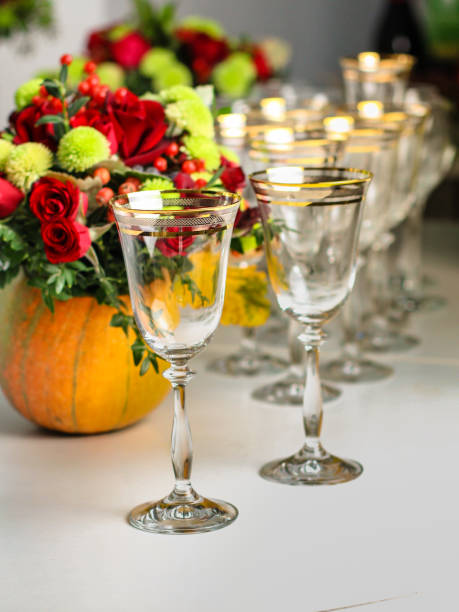 istock wine glasses on the table for drinks (close-up partial view). Festive crystal 1057291672