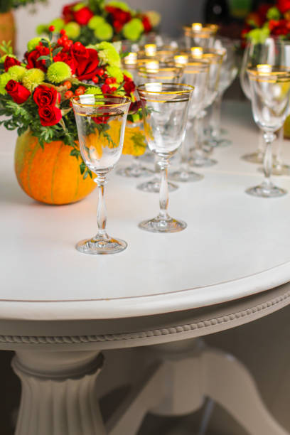 istock wine glasses on the table for drinks (close-up partial view). Festive crystal 1057291678