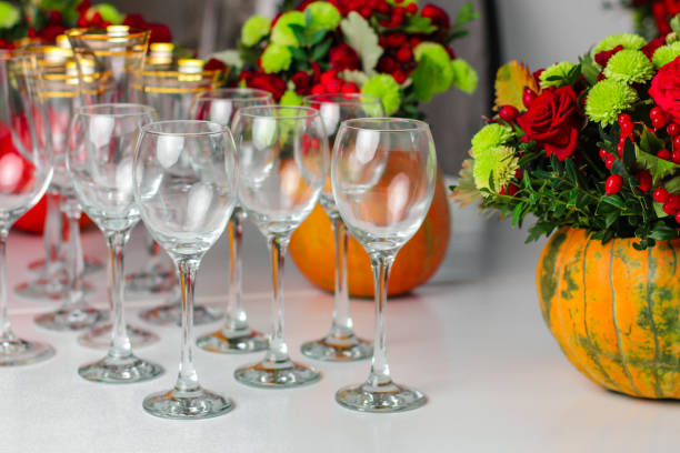 istock wine glasses on the table for drinks (close-up partial view). Festive crystal 1057291706