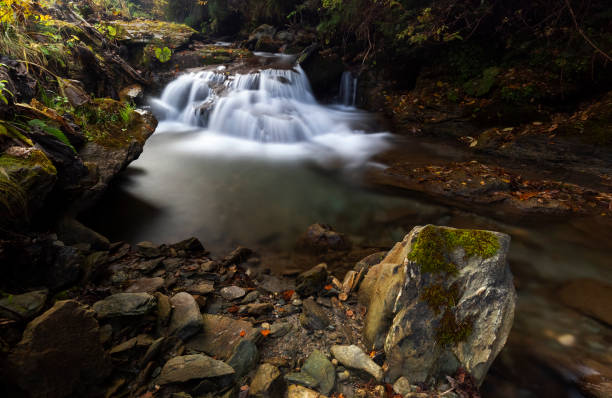 istock Little waterfall on the river in Rodnei Mountains 1057295092