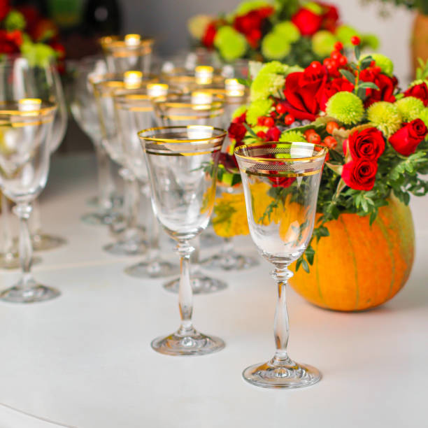 istock wine glasses on the table for drinks (close-up partial view). Festive crystal 1057295328