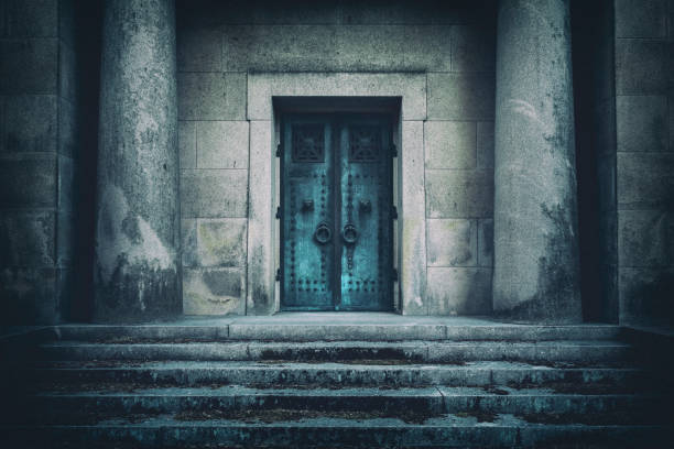 Entrance to a tomb A dark spooky crypt building with steps leading up to an entrance. crypt stock pictures, royalty-free photos & images