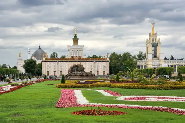MOSCOW, RUSSIA - Flowerbeds on the Main Alley of VDNKh Park and Exhibition Under Grey Skies