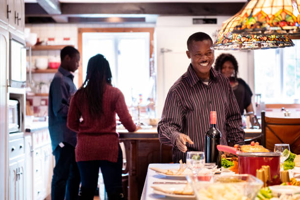 istock Thanksgiving dinner with American-African family preparing dinner 1057308406