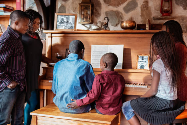 istock Thanksgiving dinner with American-African family preparing dinner 1057310834