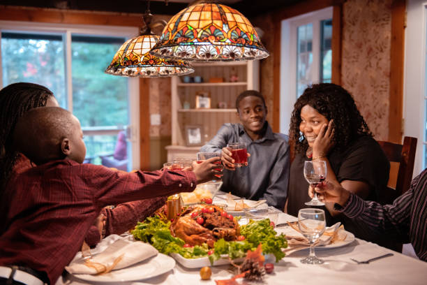 istock American-African family at table during thanksgiving dinner 1057317356