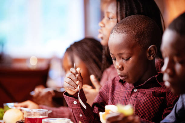 istock American-African family at table during thanksgiving dinner 1057322244