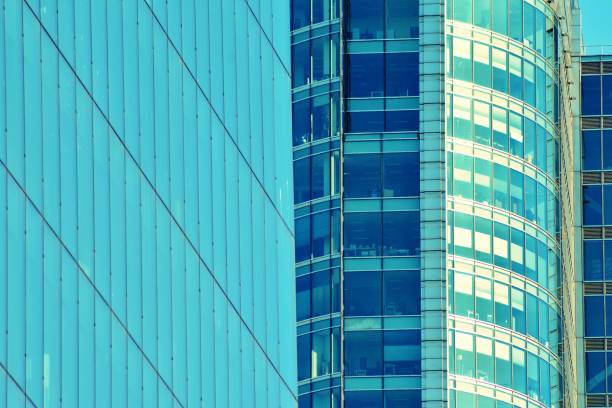 istock Modern office building on a clear sky background. Retro stylized colorful tonal filter effect 1057323270