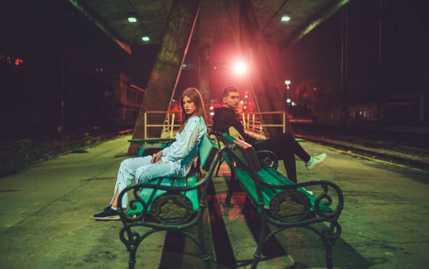 istock Young man and woman sitting separated 1057324770