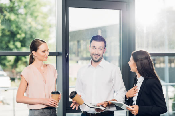 istock business colleagues having conversatino during coffee break in conference hall 1057325494