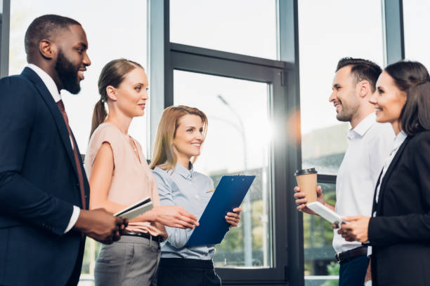 istock multicultural businesspeople having meeting in conference hall 1057325508