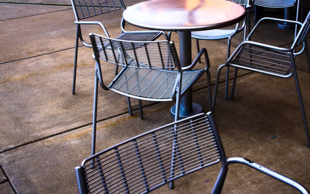 istock Empty chairs in an outdoor cafe 1057325616
