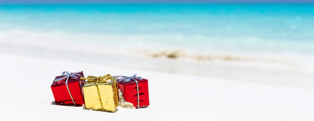 istock Packed gifts on sand with azur sea background 1057332986