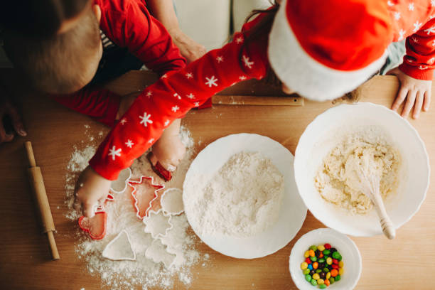 istock Kids making cookies with dough 1057338386