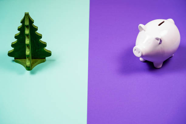 Piggy bank, christmas tree with copy space. Saving and christmas holiday concept.